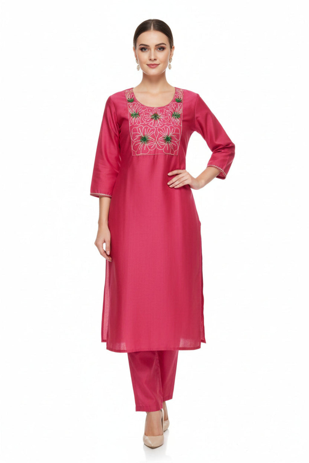 Woman wearing a pink embroidered kurta with pants on a white background