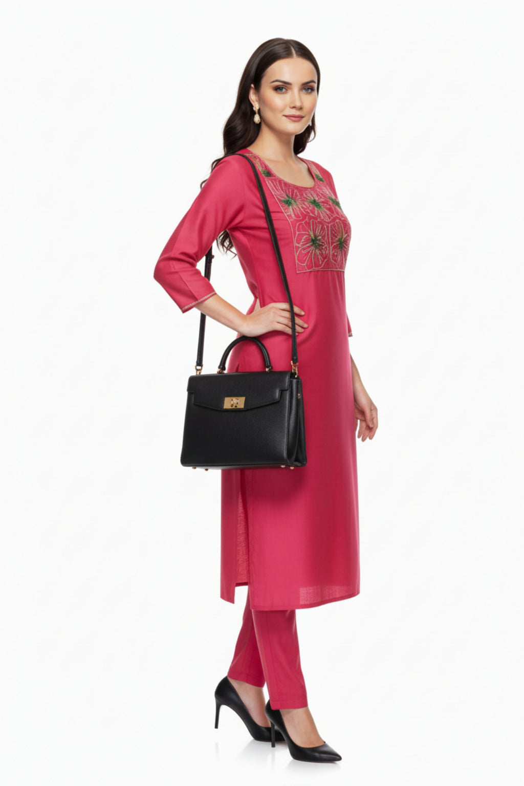 Woman in a pink outfit with black handbag on a white background