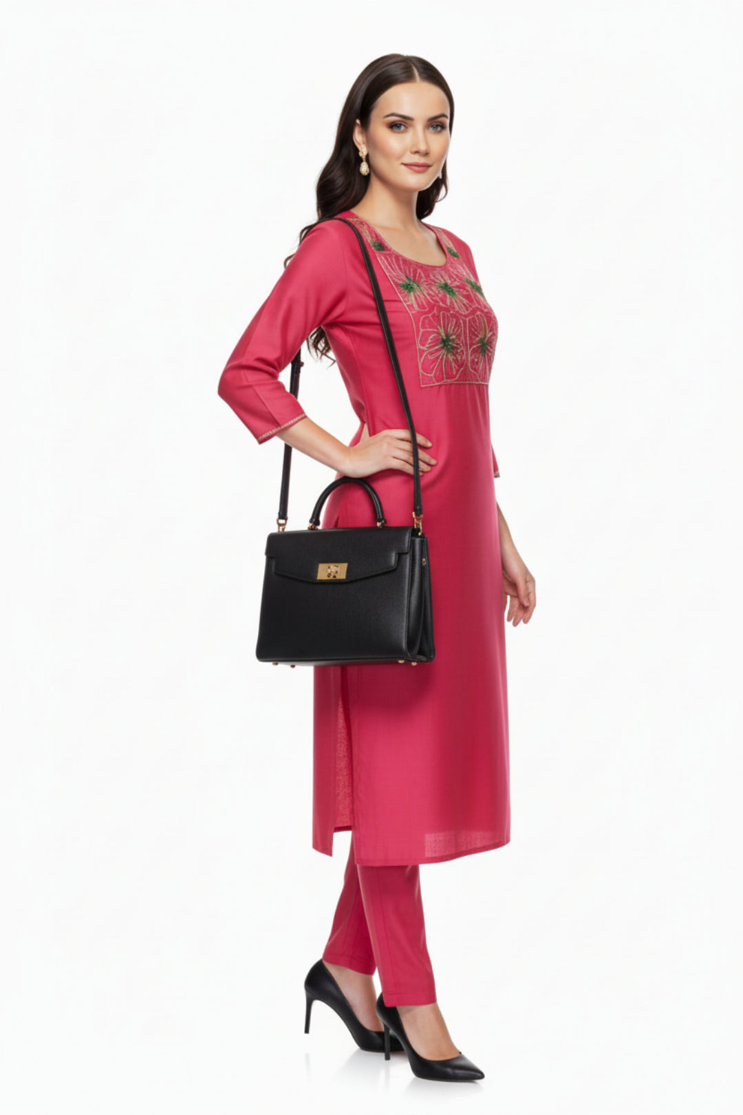 Woman in a pink outfit with black handbag on a white background