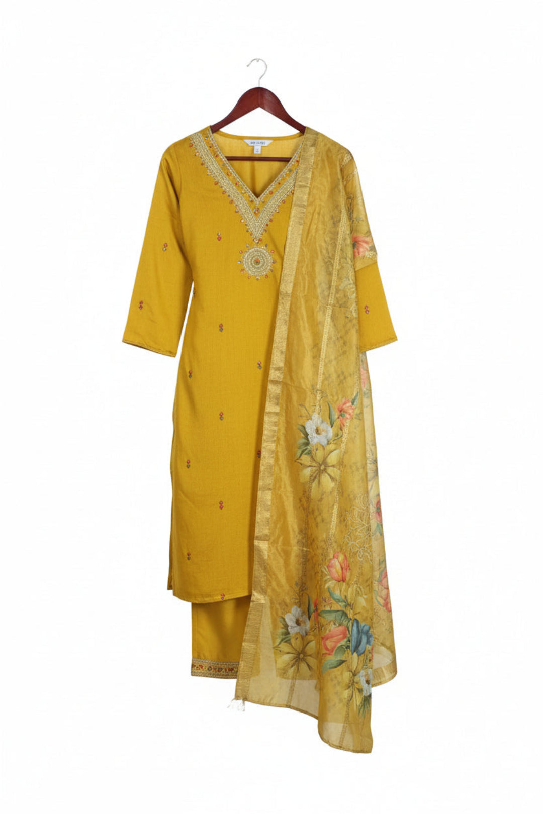 Two women wearing yellow traditional outfits with floral patterns on a white background