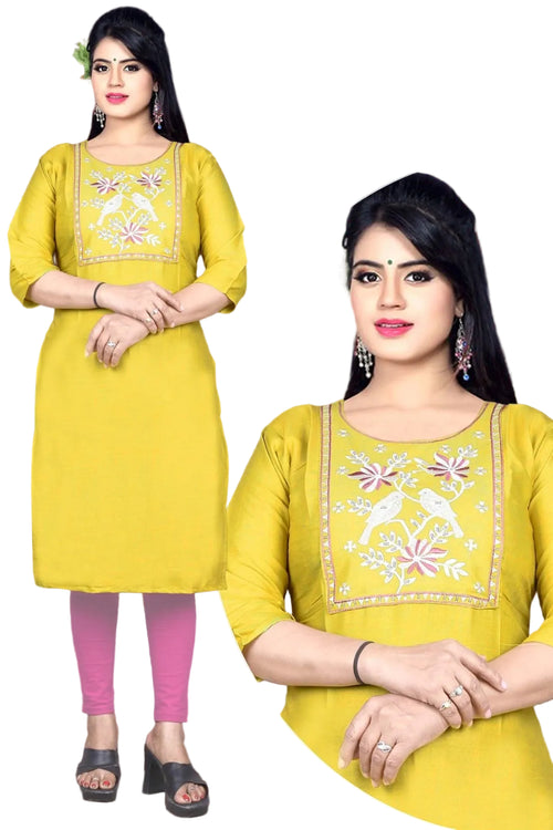 Yellow embroidered kurta with pink leggings worn by a model, against a decorative background.