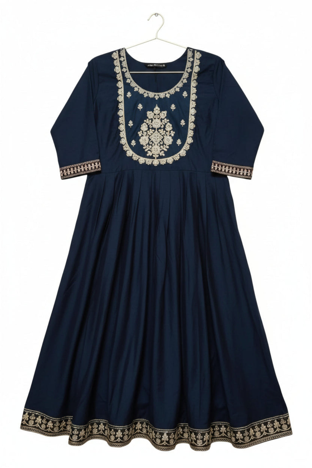 Navy blue dress with intricate white embroidery on a light background
