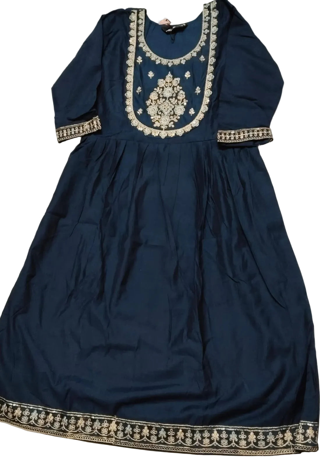 Navy blue dress with intricate white embroidery on a light background