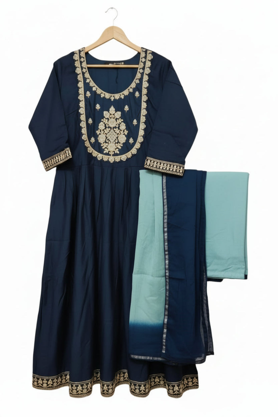Navy blue traditional outfit with gold embroidery and light blue pants on a white background