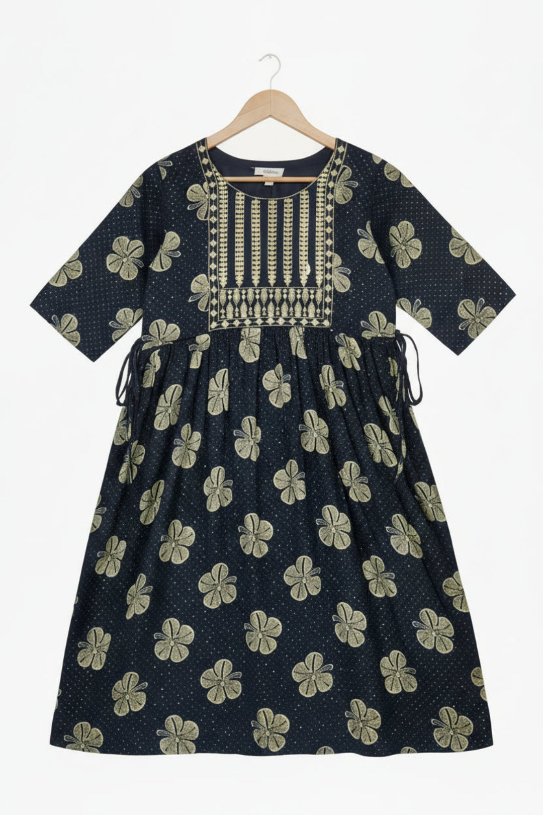 Navy blue dress with white floral pattern and decorative neckline on a white background