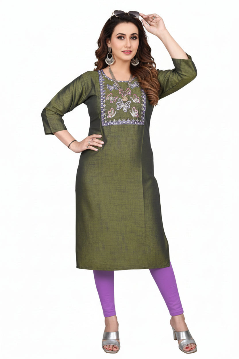 Woman wearing a green embroidered kurta with purple leggings on a white background
