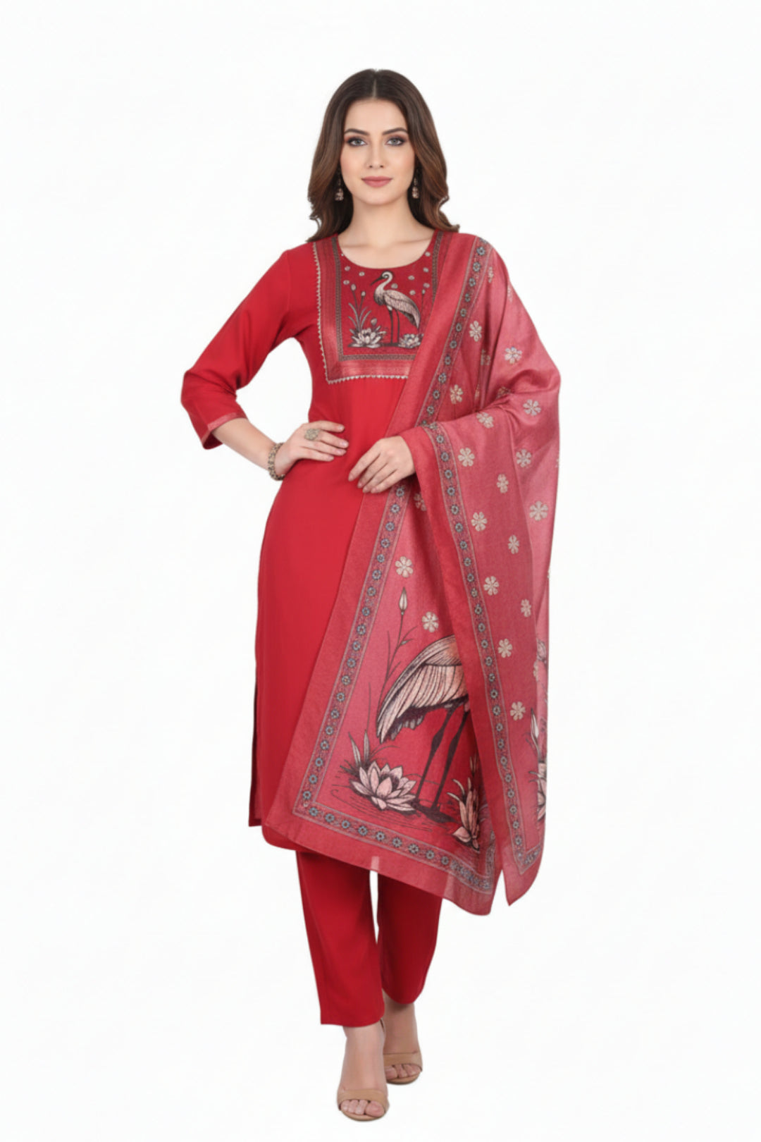 Red scarf with bird and flower pattern draped over a red outfit on a white background