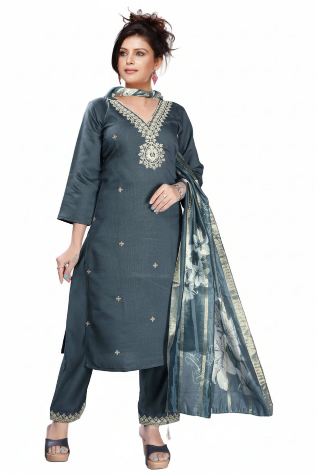 Woman wearing a gray traditional outfit with a floral dupatta on a white background