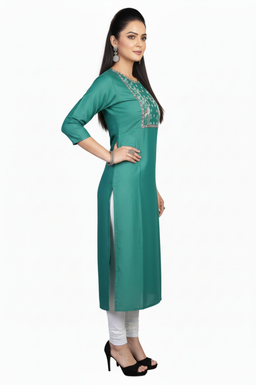 Woman wearing a teal green kurta with white embroidery on a white background