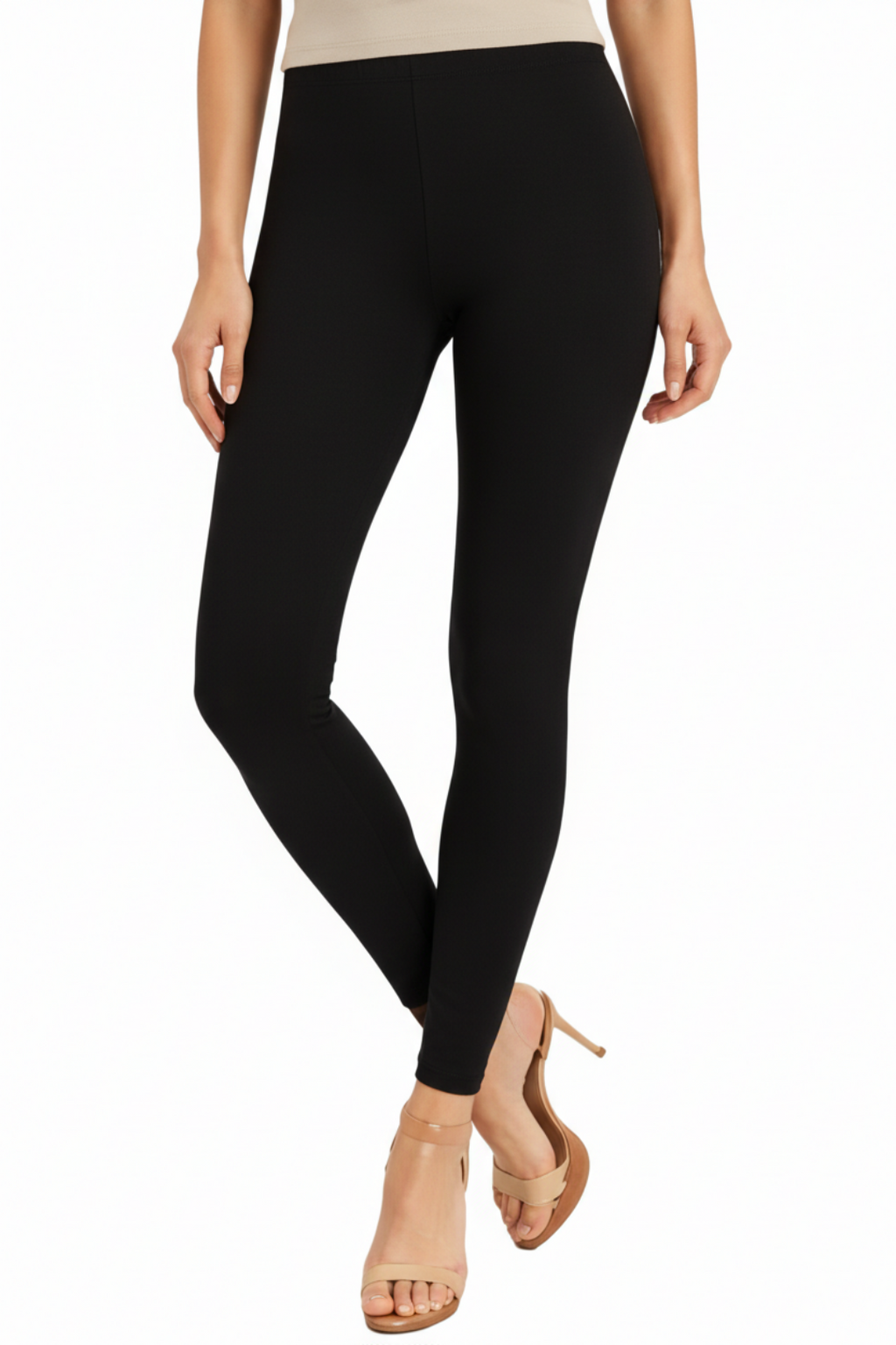 Black leggings worn by a person on a white background