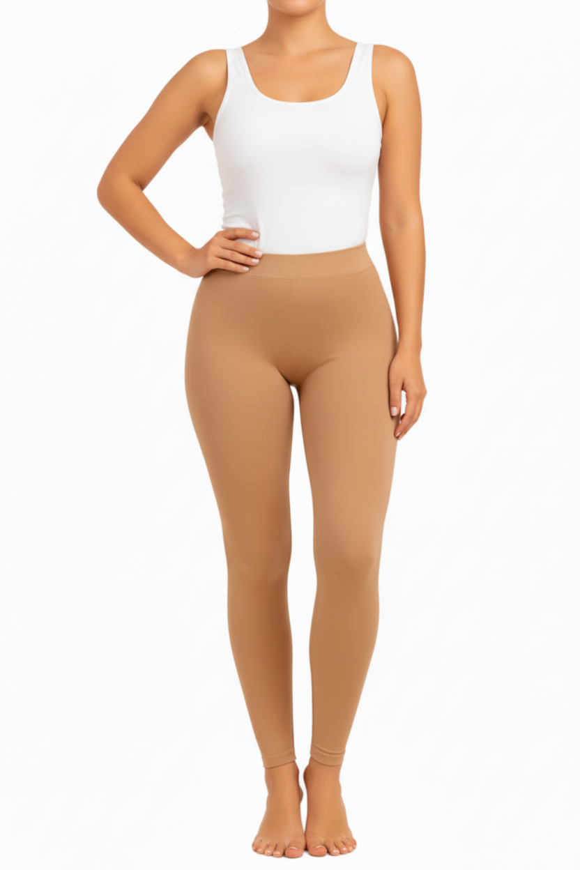 Tan leggings worn by a person on a white background