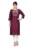 Maroon embroidered kurta with white patterns worn by a model on a white background