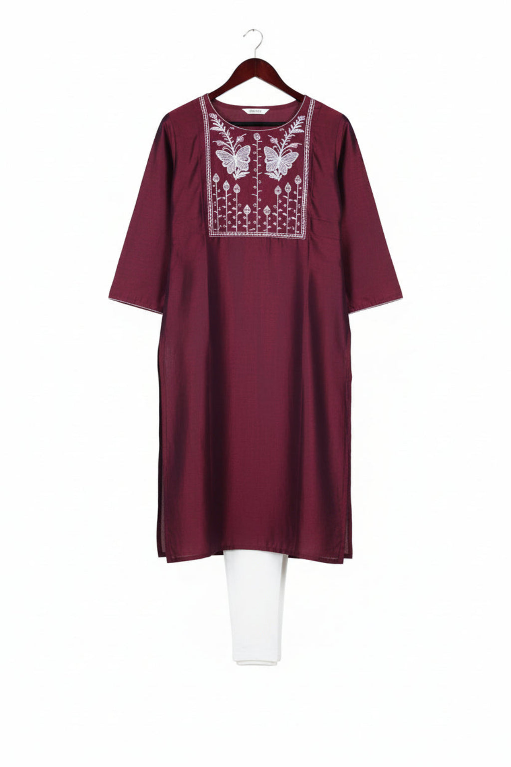 Maroon kurta with white embroidery on a white background