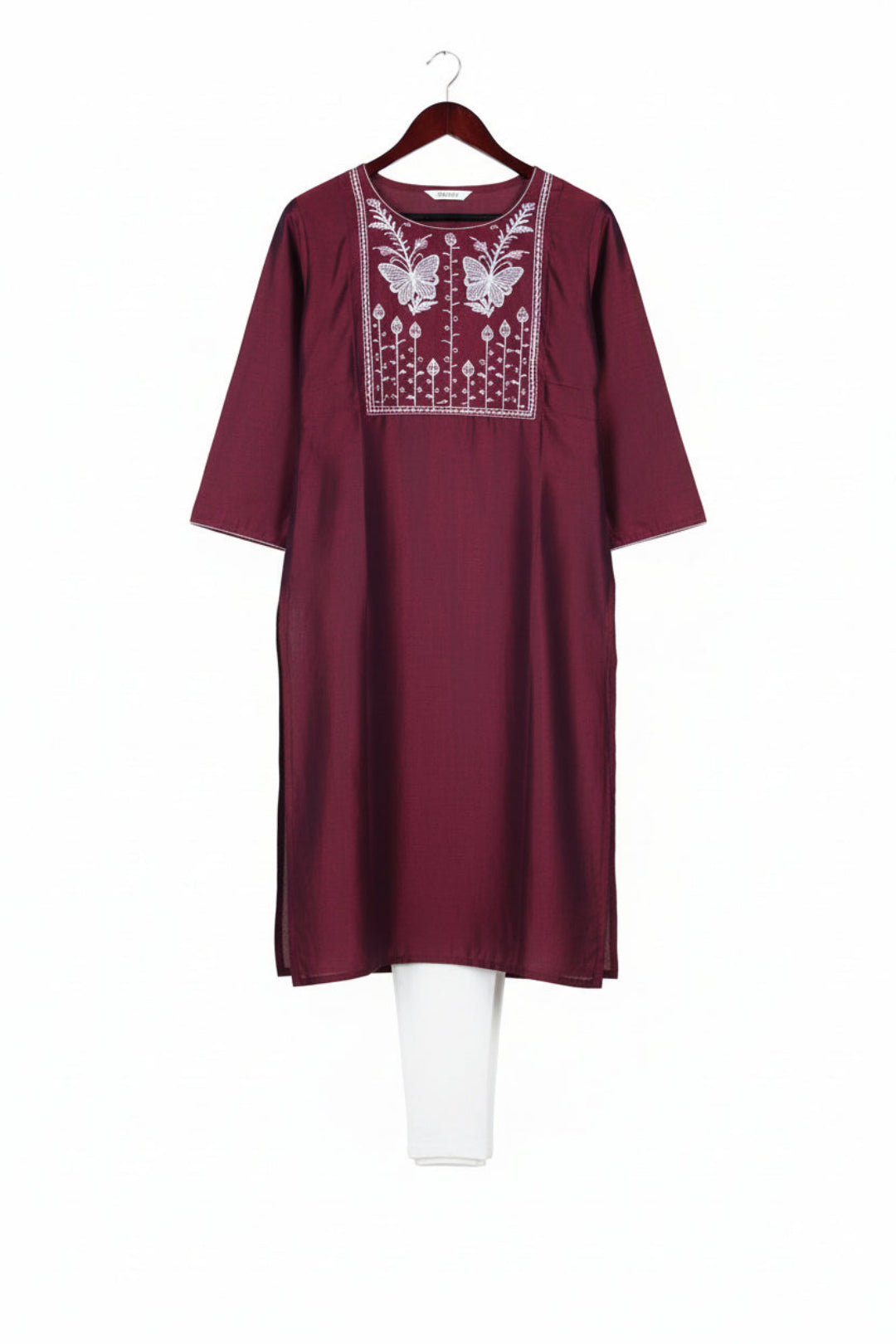 Maroon kurta with white embroidery on a white background