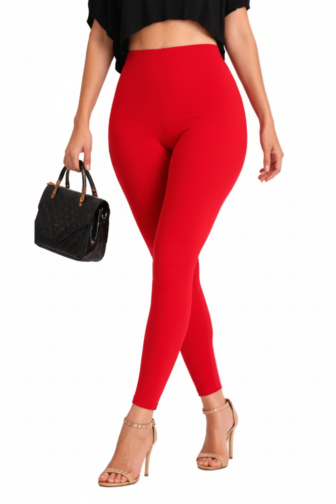 Person wearing red leggings with a black top and high-heeled shoes on a white background