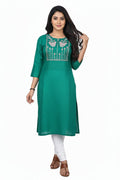 Green kurta with white embroidery on a white background
