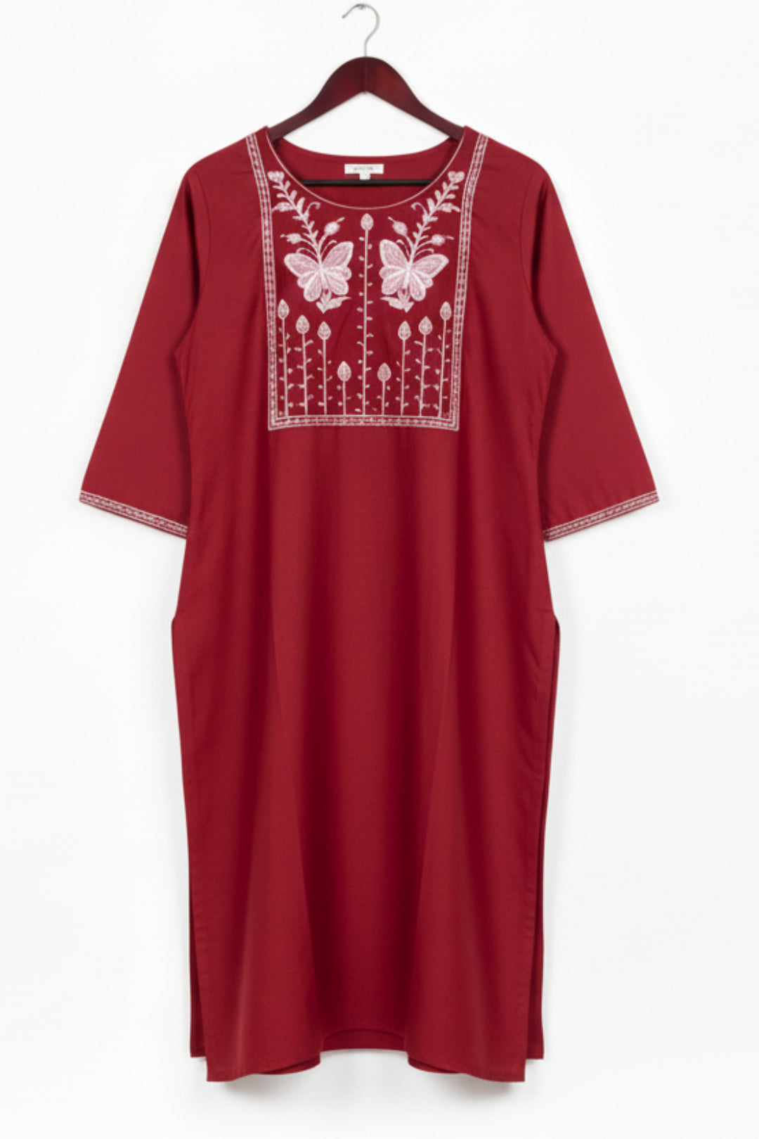 Green kurta with white embroidery on a white background